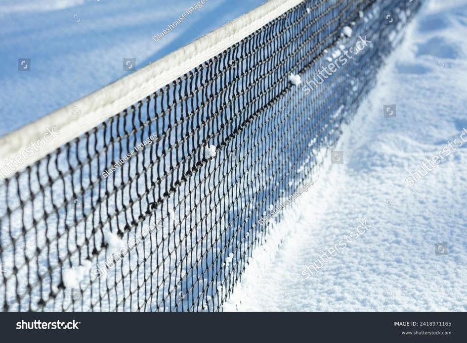 stock-photo-tennis-net-and-winter-snow-2418971165.jpg