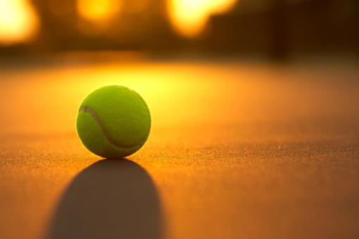 stock-photo-tennis-ball-at-sunset.jpeg