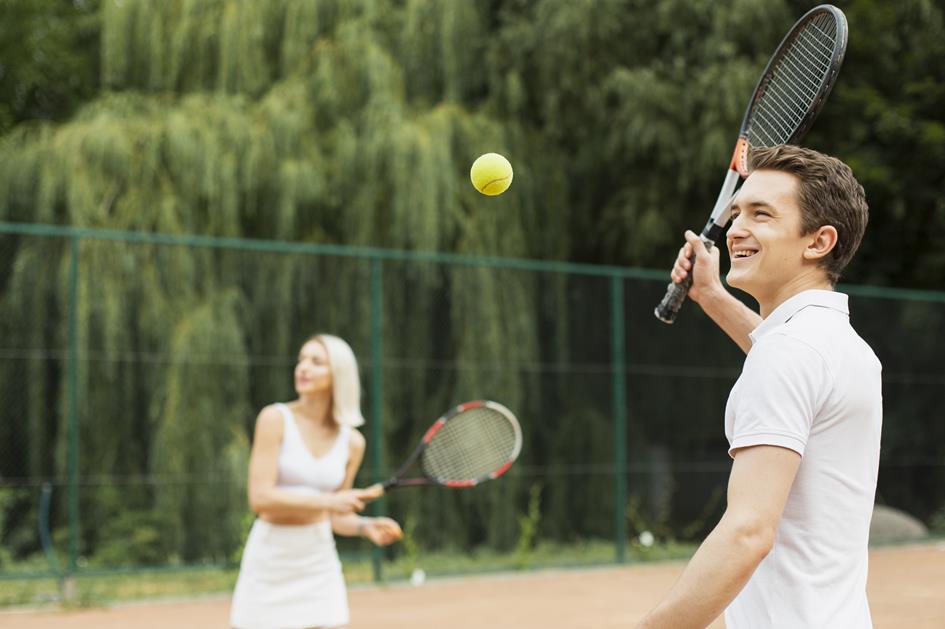 young-man-woman-playing-tennis.jpg