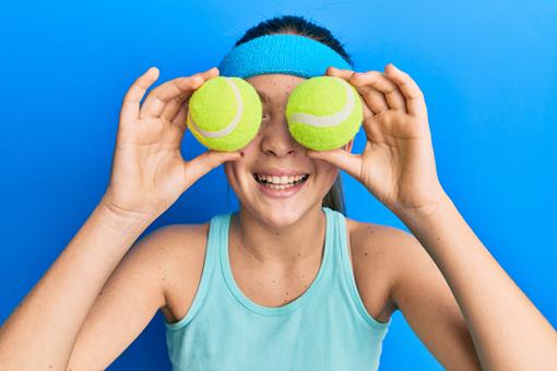 beautiful-brunette-little-girl-holding-tennis-ball-close-eyes-smiling-laughing-hard-out-loud-because-funny-crazy-joke.jpg