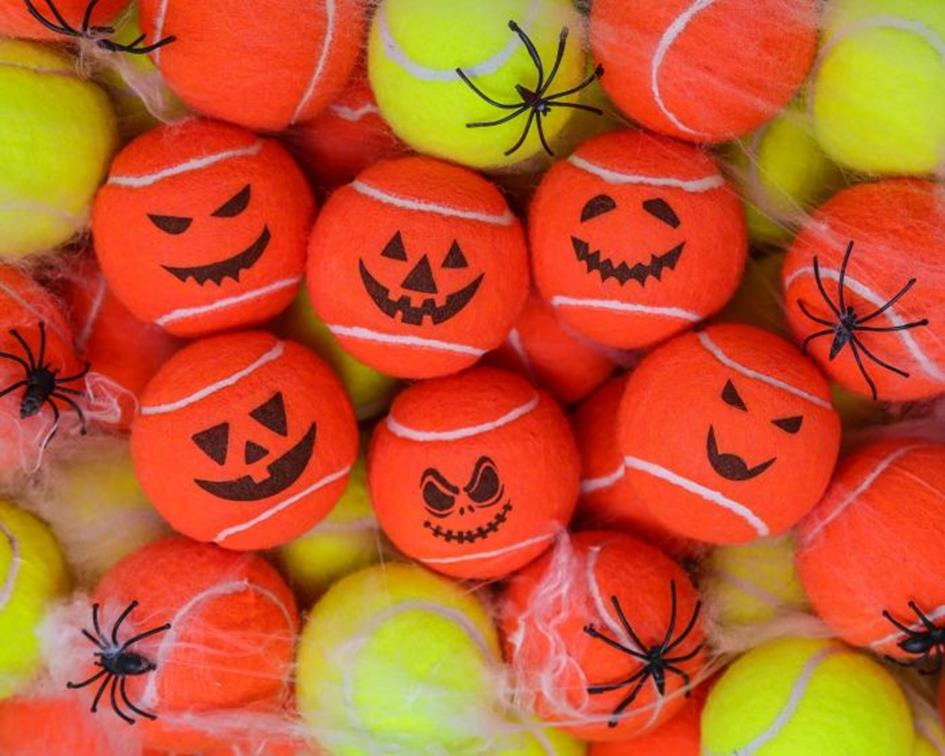 small_pumpkins_on_yellow_tennis_balls_with_spiders.jpg